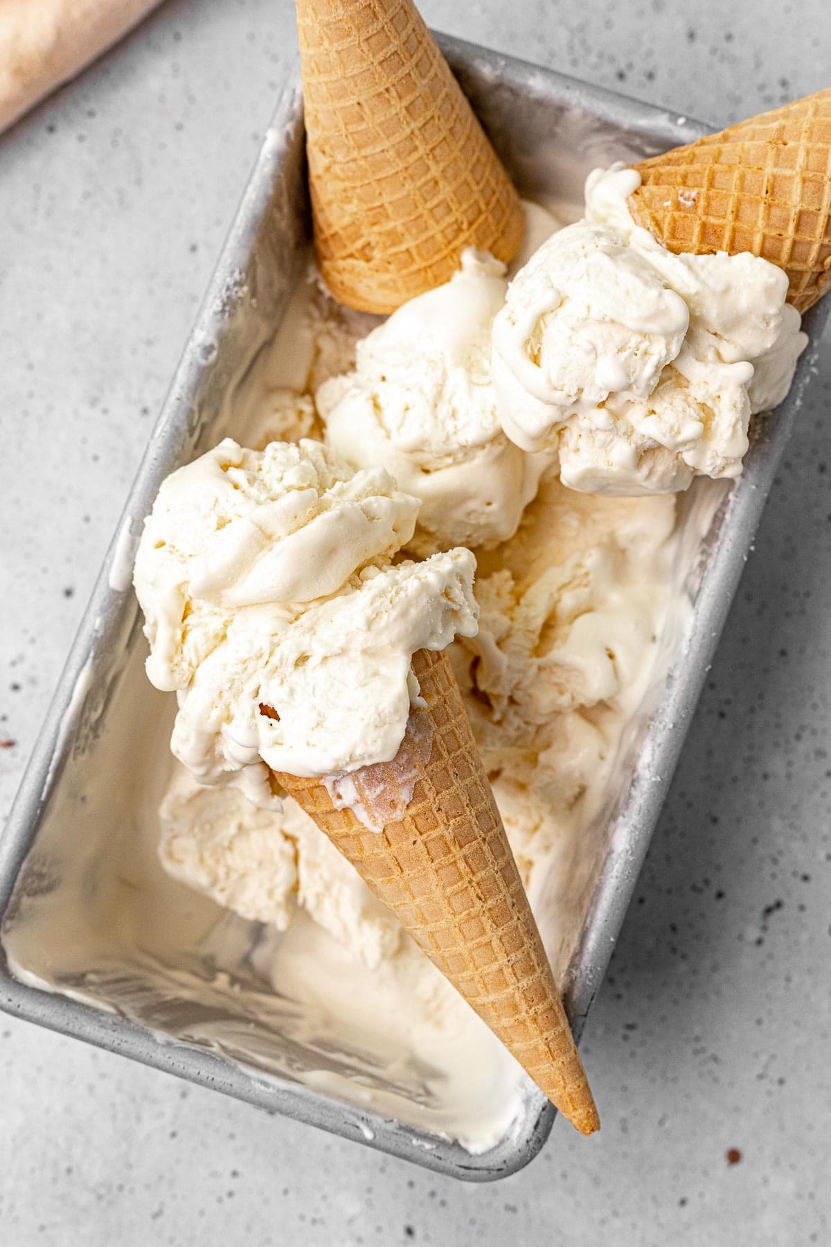 No Churn Vanilla Ice Cream scoops on cones