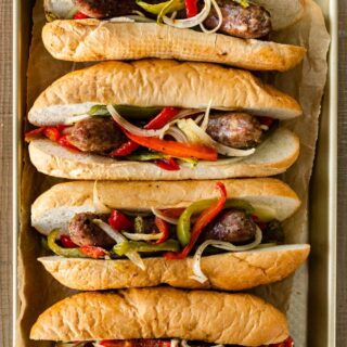 Sheet Pan Sausage and Peppers in hoagie rolls