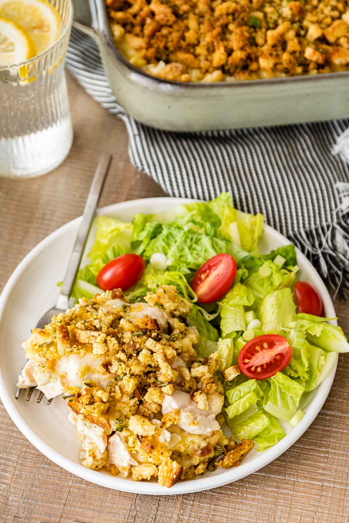 Swiss Chicken Casserole on serving plate with salad