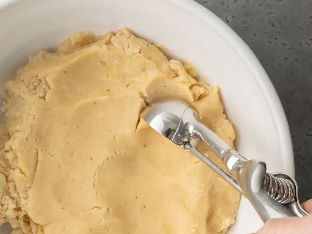 Dough being scooped into balls.