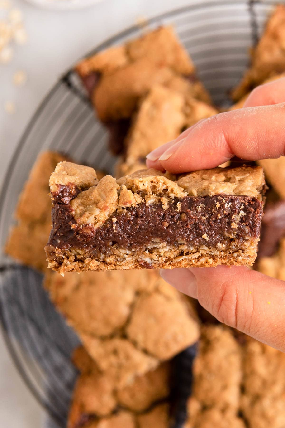 Chewy Chocolate Oat Bars close up in hand