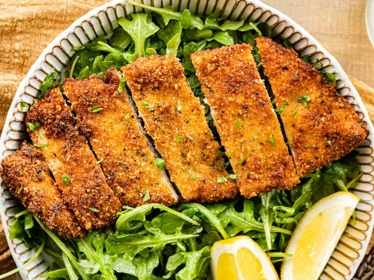 Cut chicken served on plate