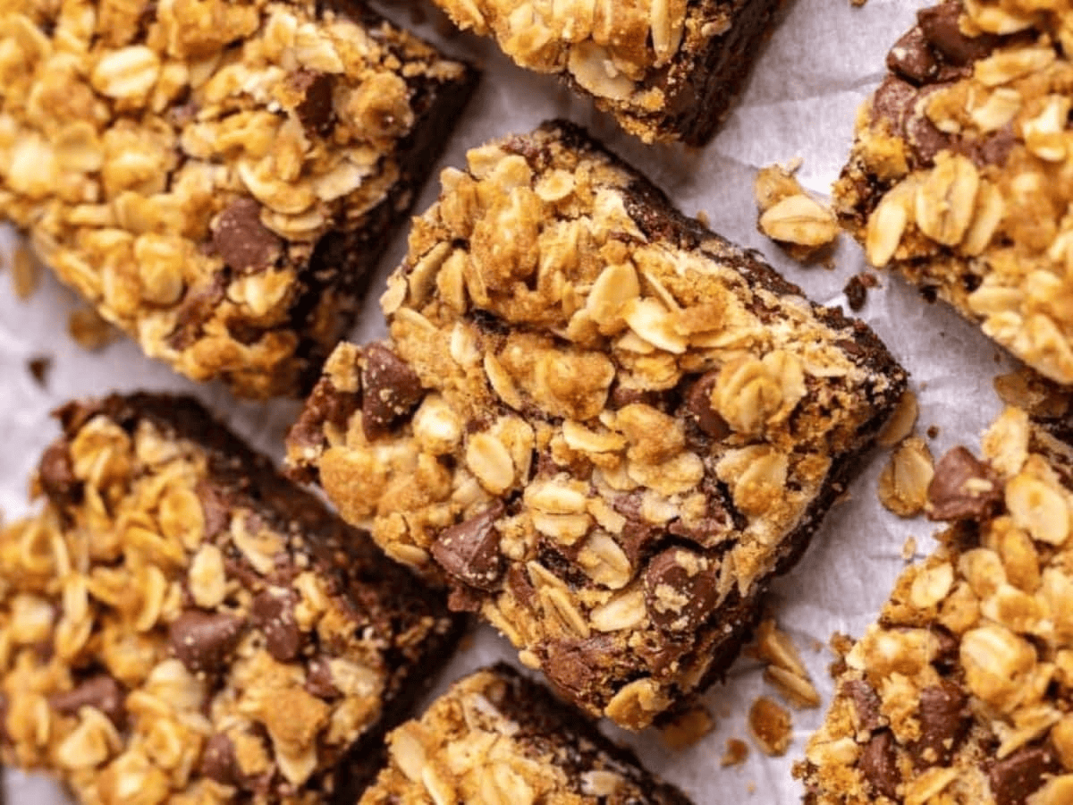 Brownies with oatmeal cut up, separated on parchment paper