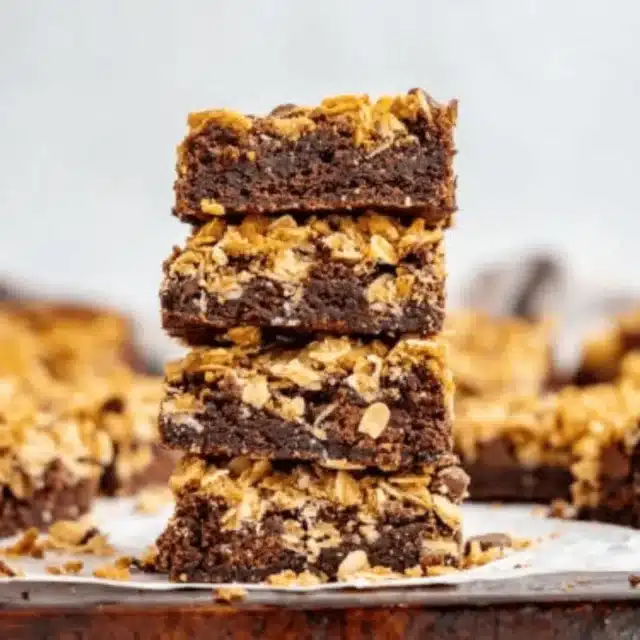Stack of Brownies with oatmeal with brownies in the background
