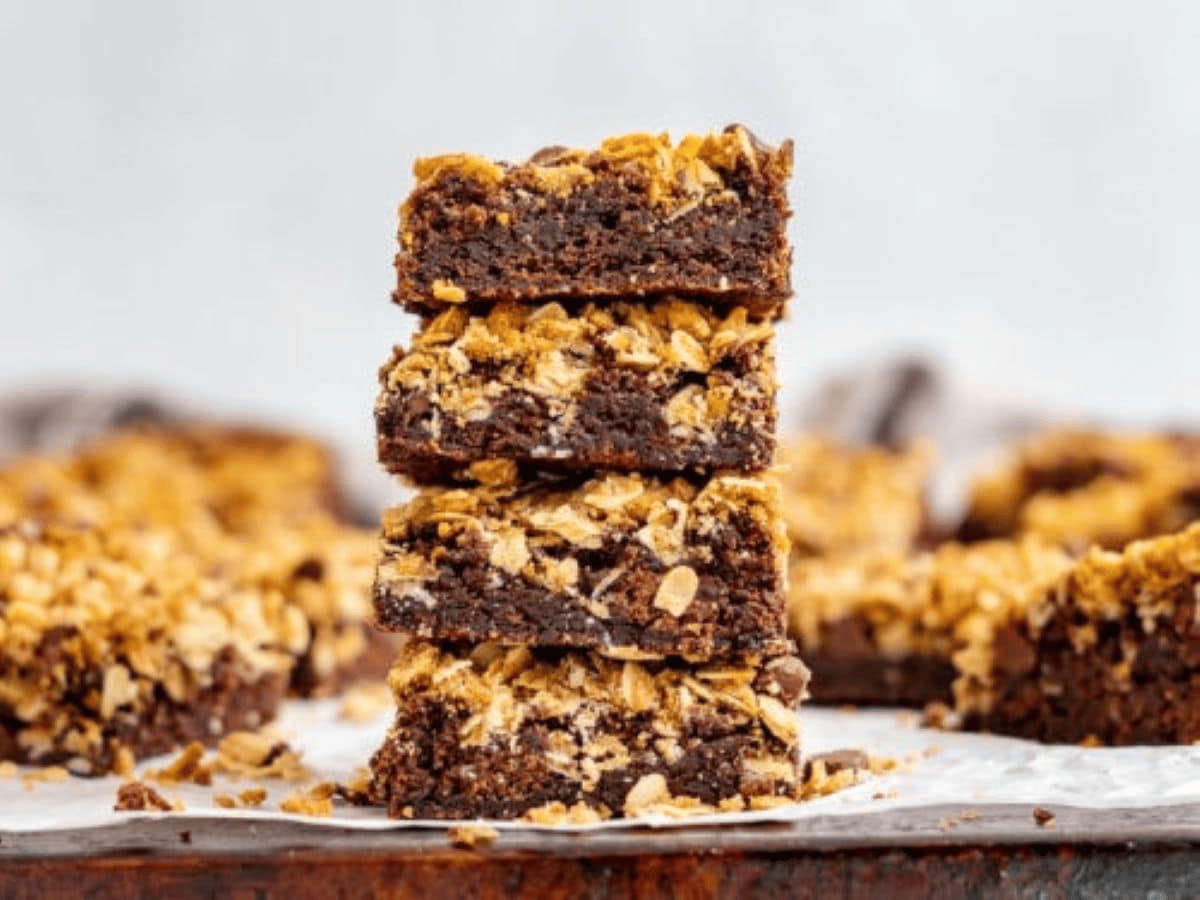 Stack of Brownies with oatmeal with brownies in the backround