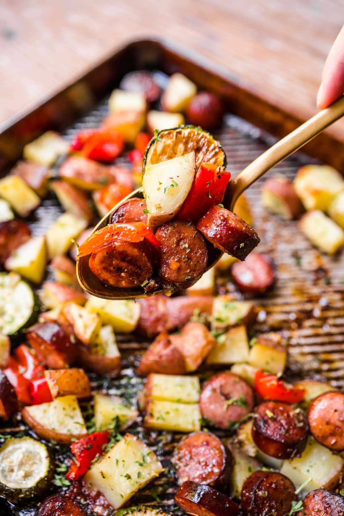 Sheet Pan Sausage and Vegetables close up spoonful