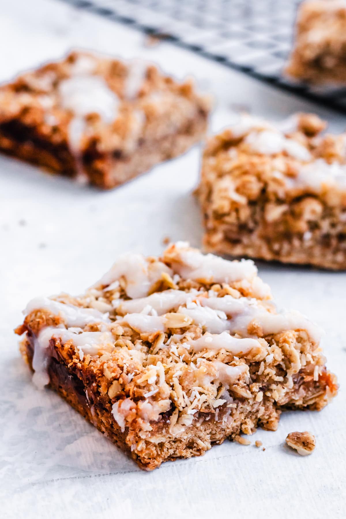 Tropical Oatmeal Bars with coconut glaze on table