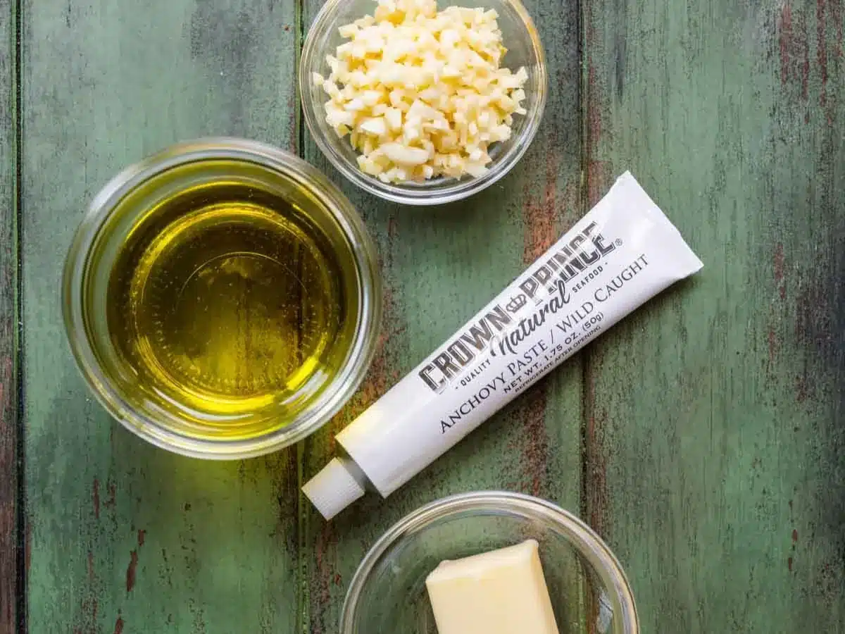 Portioned olive oil, garlic, anchovy paste, and butter.