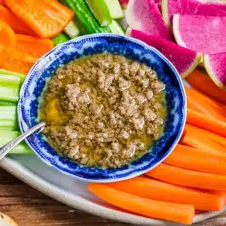 Buttery warm dipping sauce on a veggie tray.