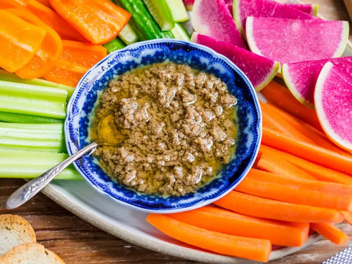 Buttery warm dipping sauce on a veggie tray.