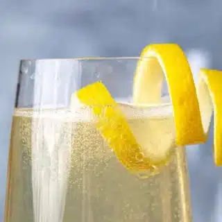 Champagne flute with lemon twist.