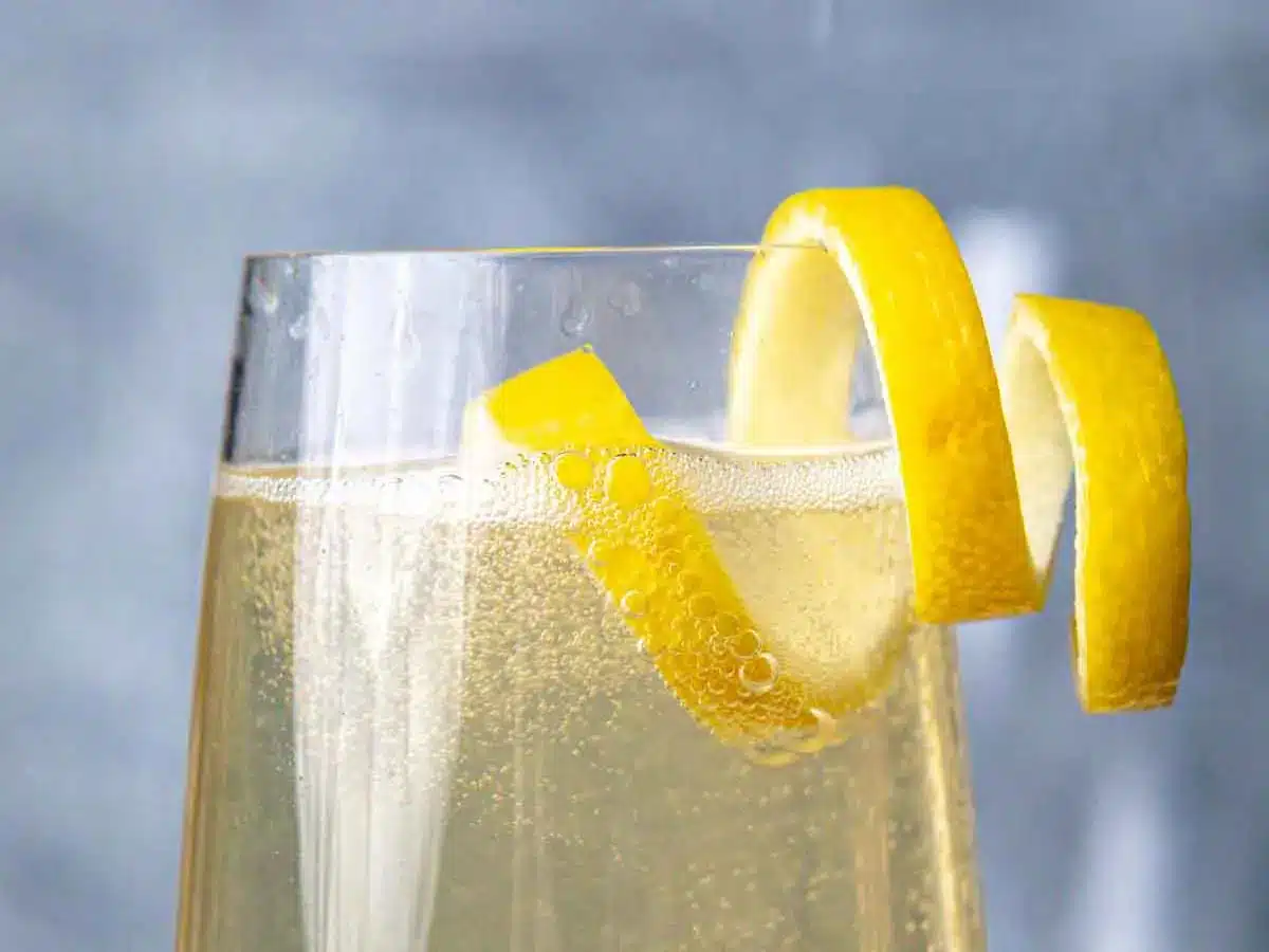 Champagne flute with lemon twist.