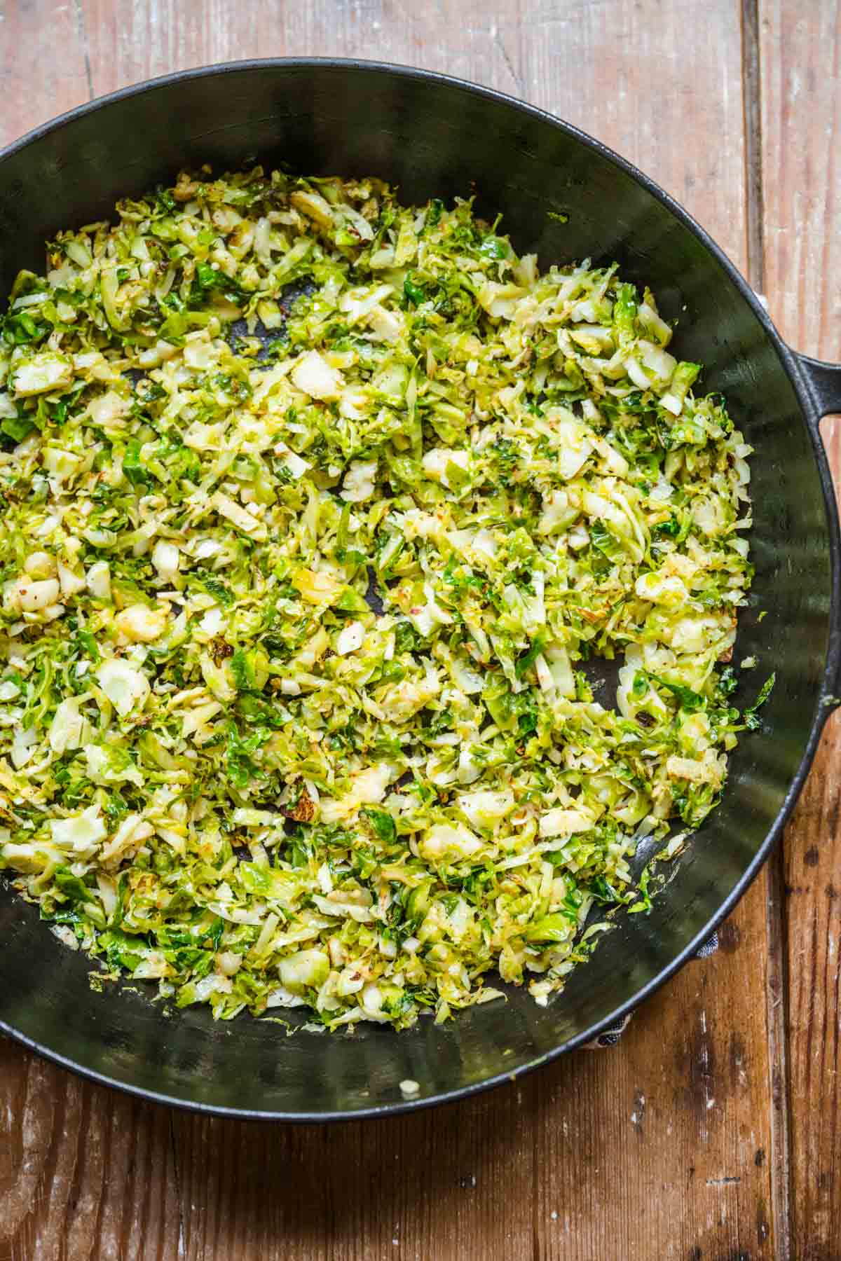 Brussels Sprouts with Bacon shaved brussels sprouts in cooking pan