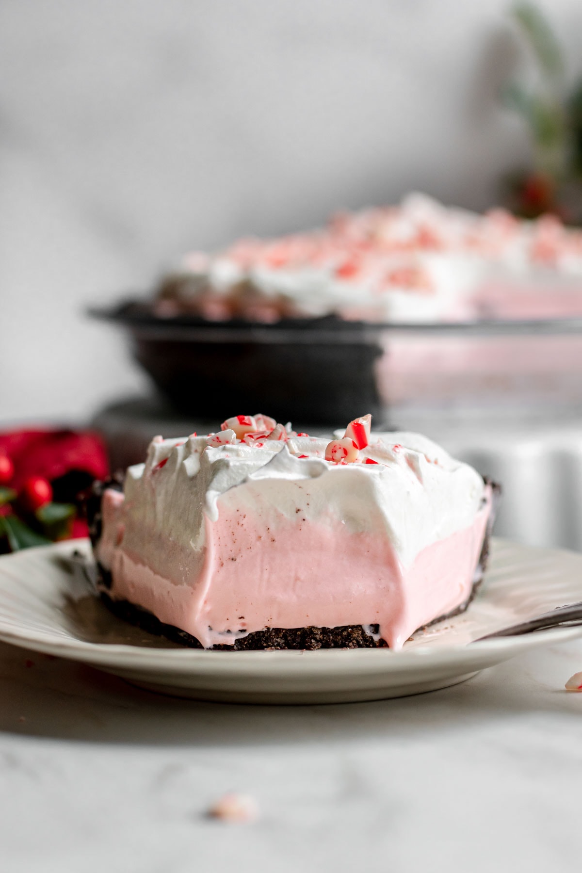 Candy Cane Pie slice on serving plate with spoonful taken out