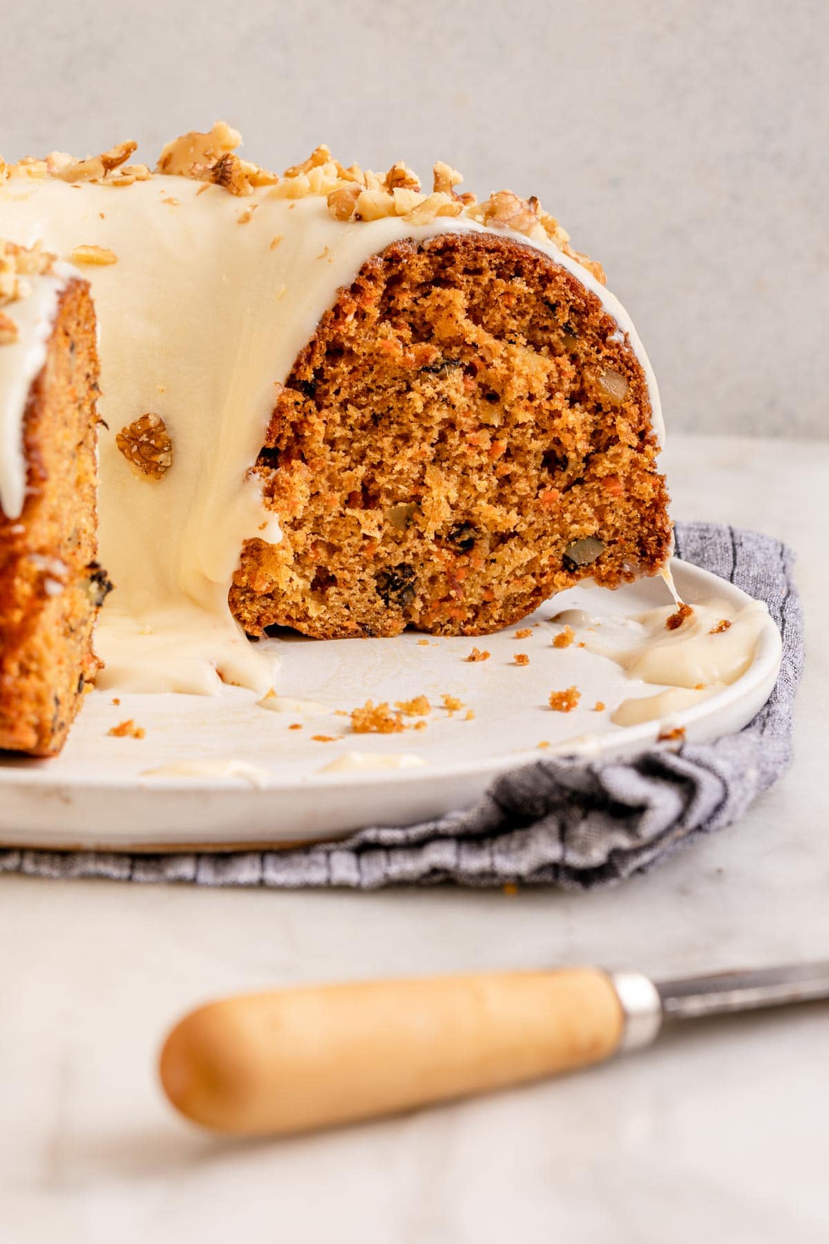 Carrot Bundt Cake sliced on cake platter 