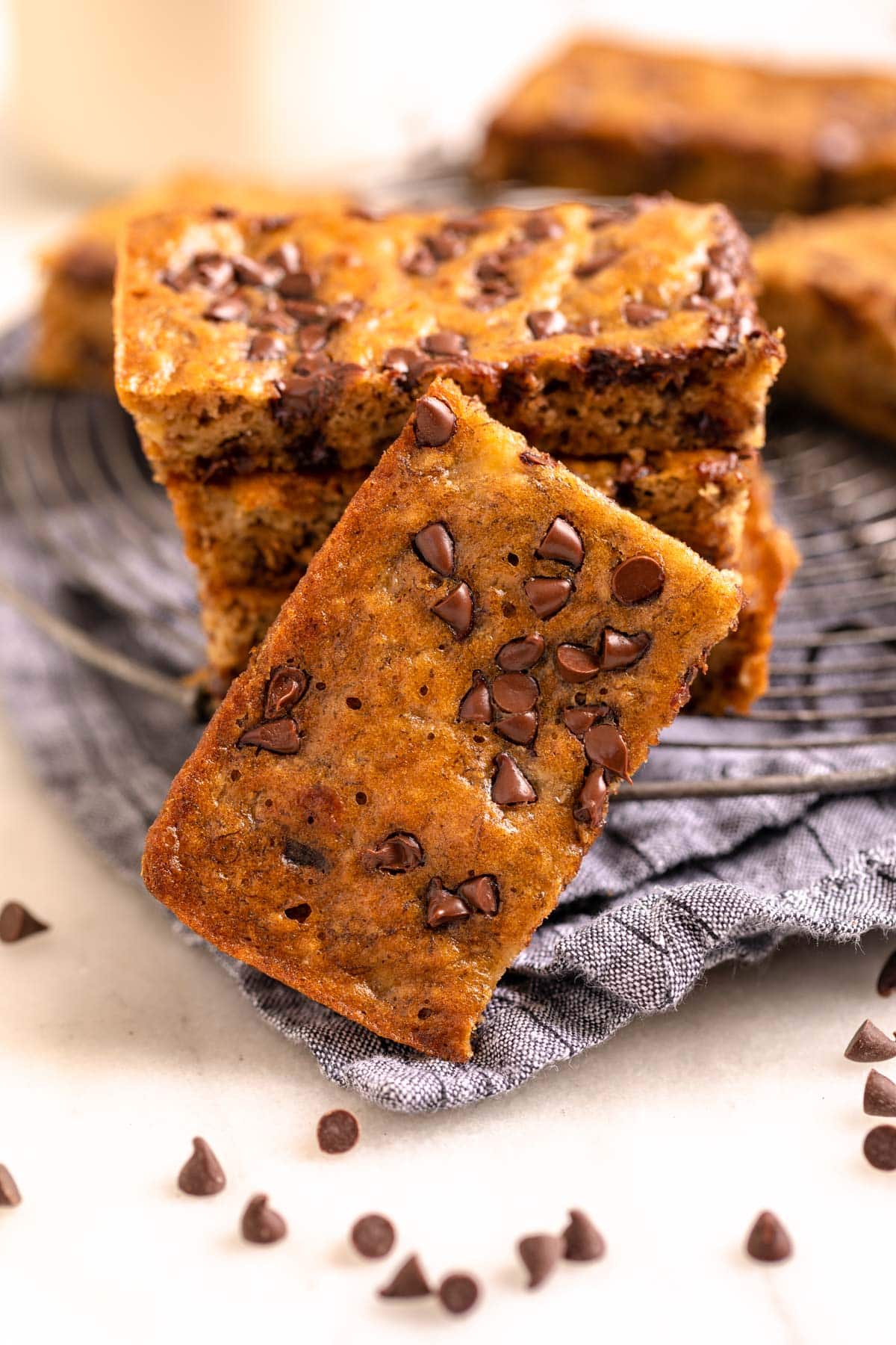 Chocolate Chip Banana Bars stacked on cooling rack