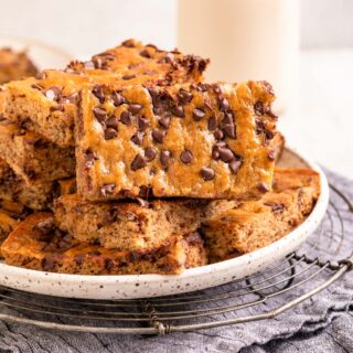Chocolate Chip Banana Bars stacked on serving platter 1x1