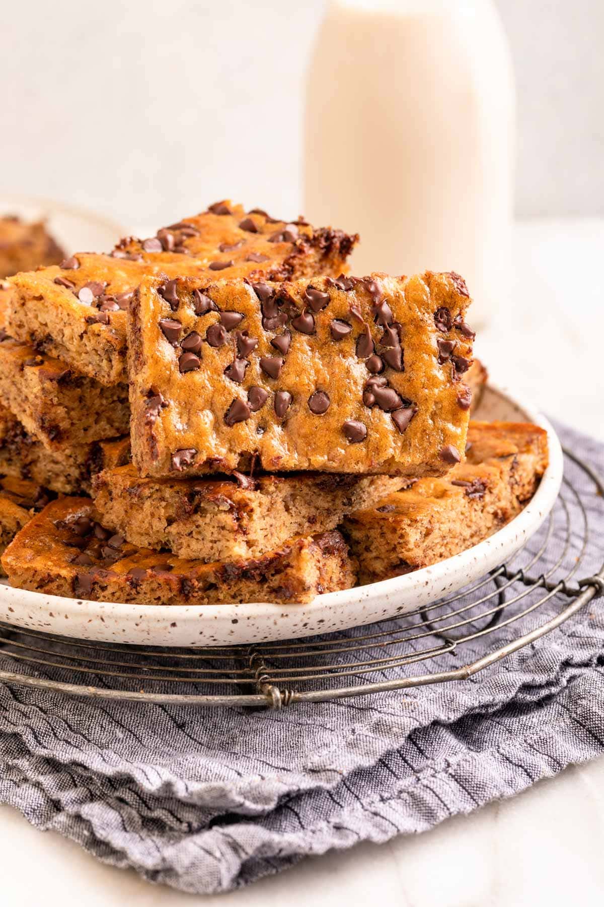 Chocolate Chip Banana Bars stacked on serving platter