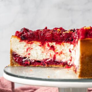 Cranberry Cheesecake on cake stand sliced 1x1