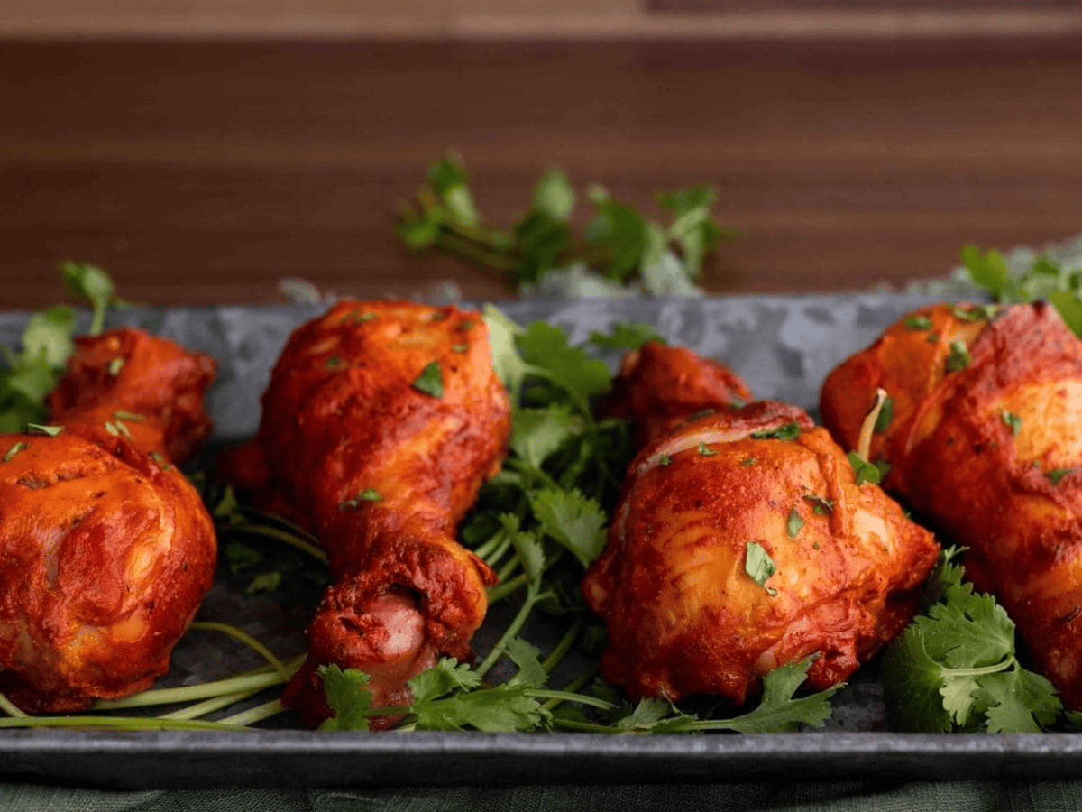 Chicken legs laid out on serving tray