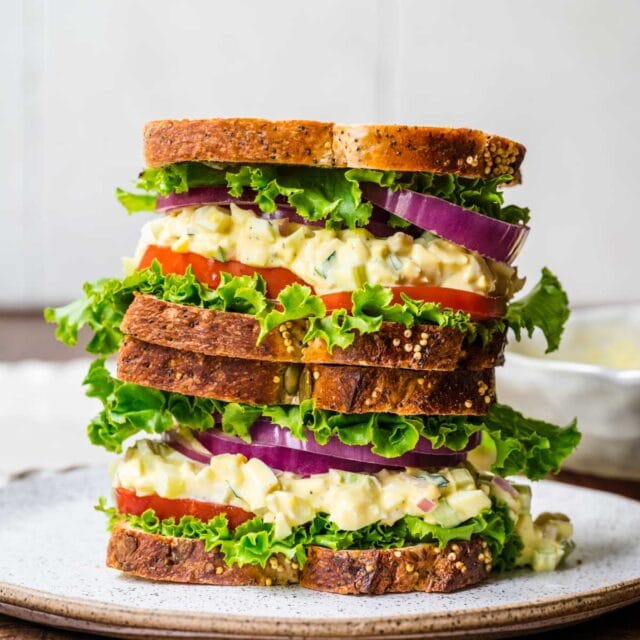 Egg Salad Sandwich stacked on serving plate 1x1