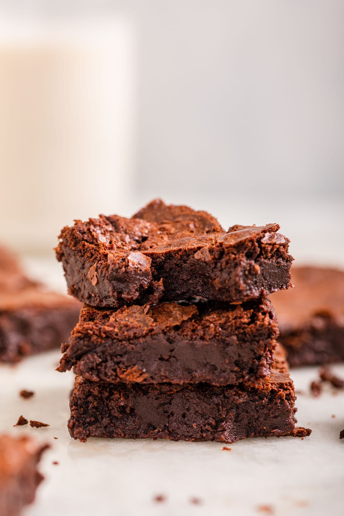 Flourless Brownies stack on countertop showing interior