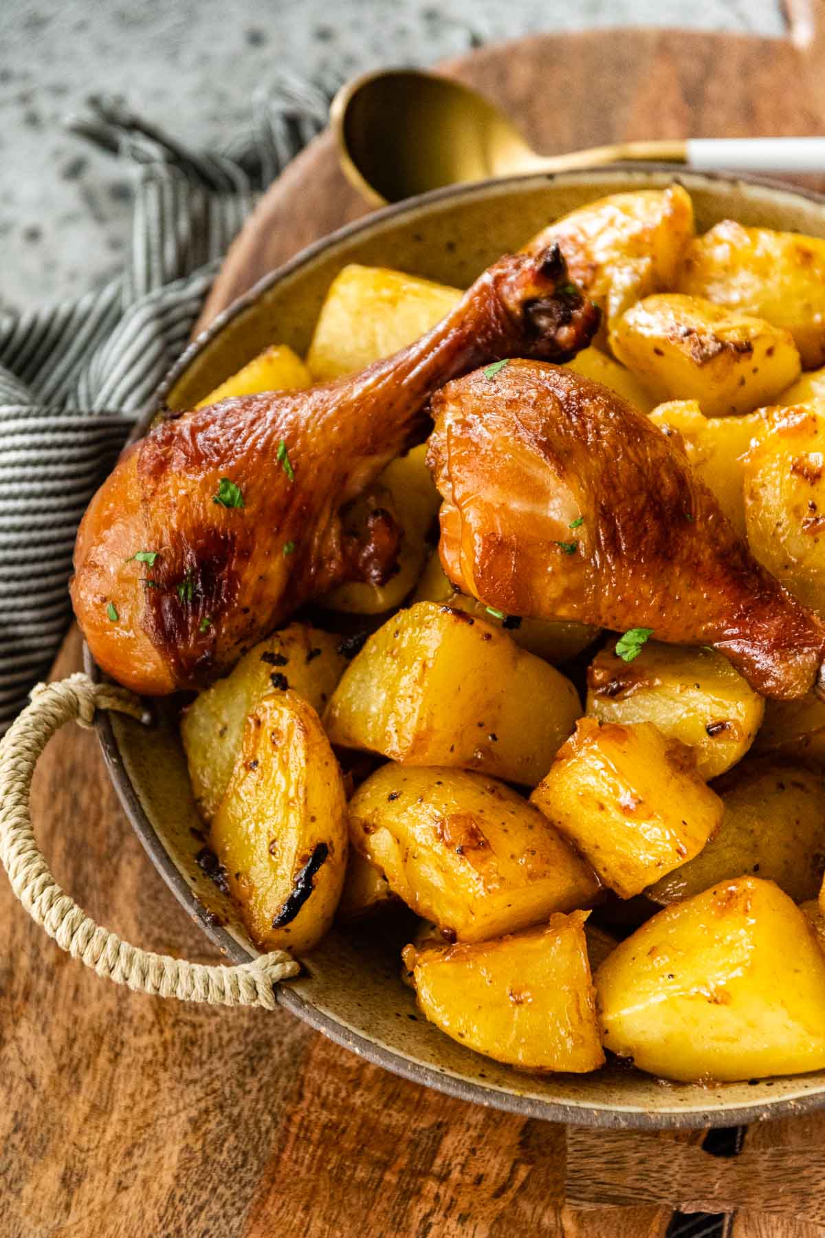 Honey Mustard Roasted Potatoes in serving bowl with chicken