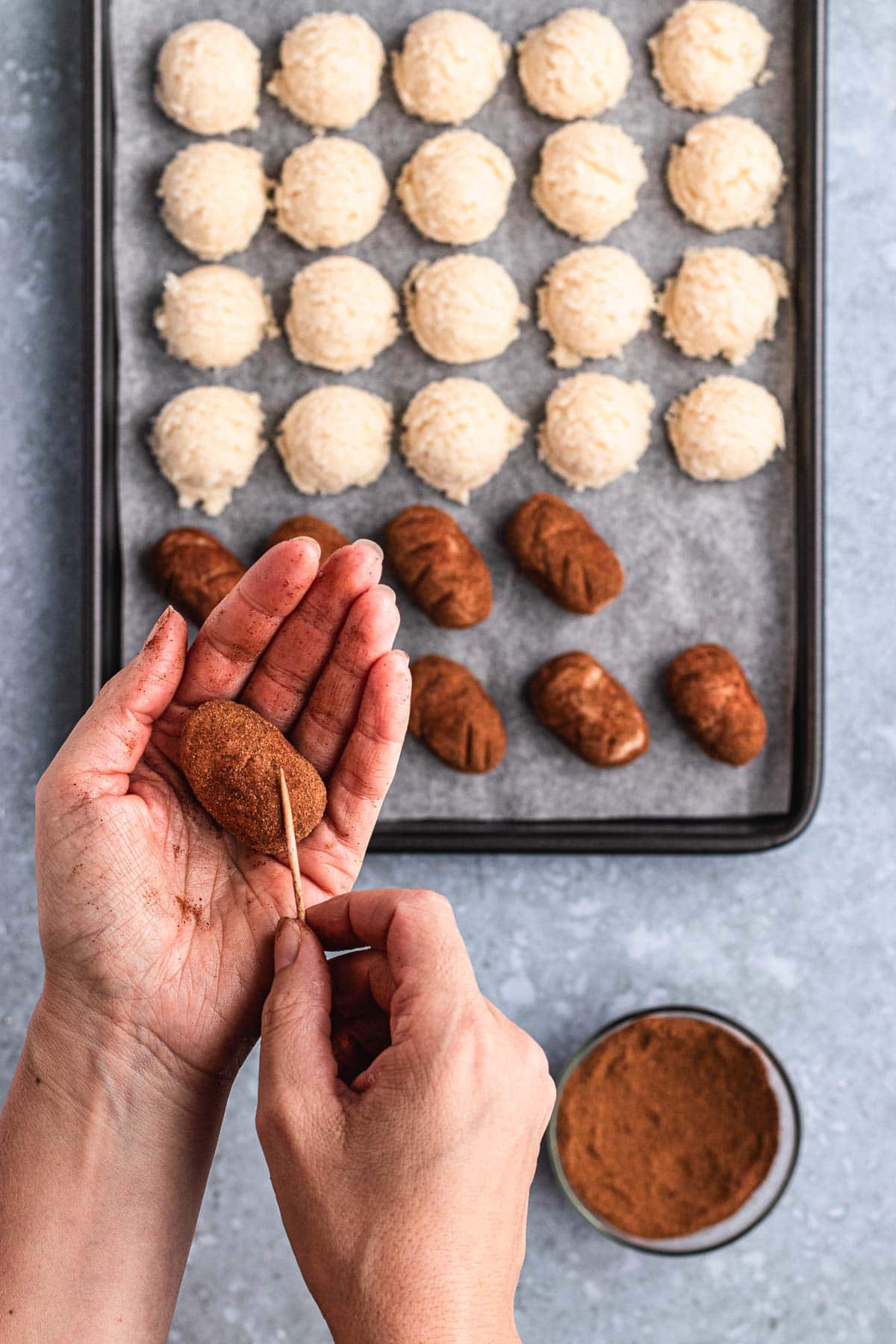 Irish Potato Candy shaping a dough ball with toothpick