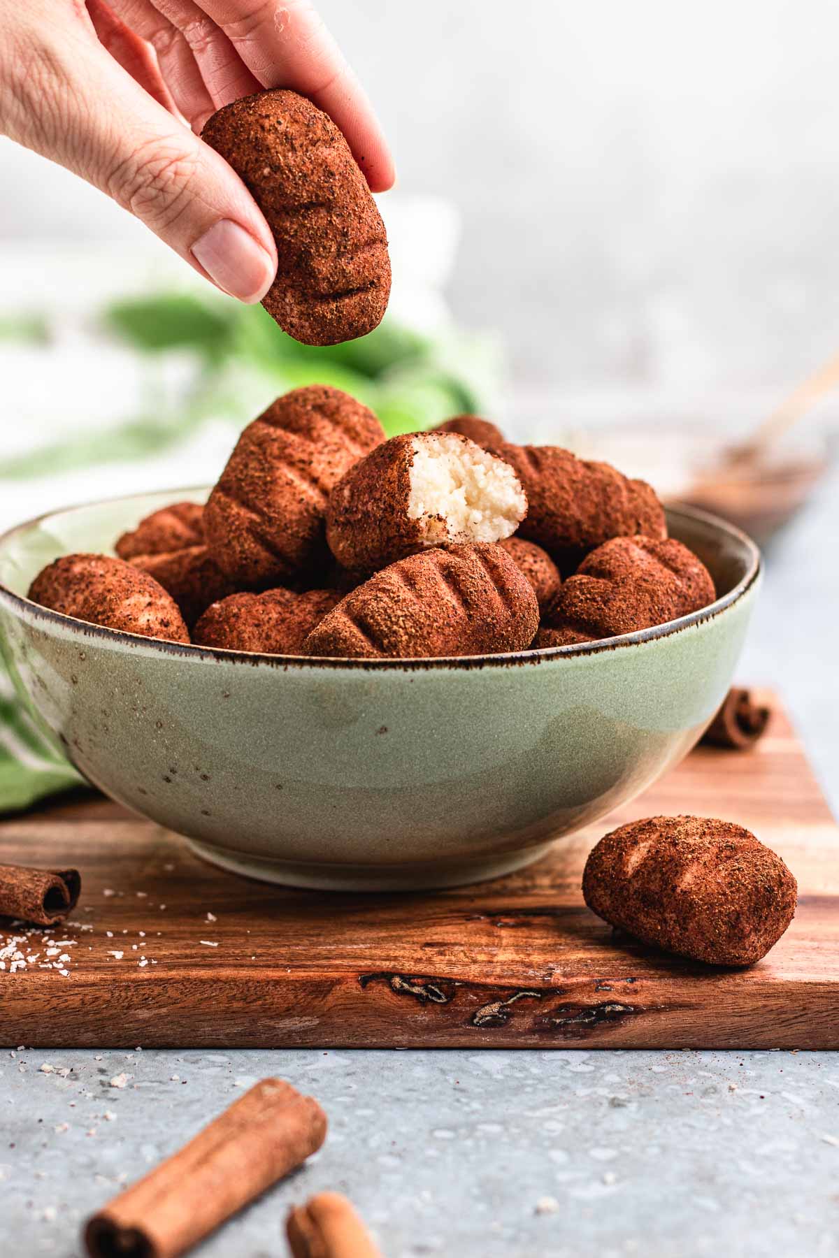 Irish Potato Candy taking one from serving bowl