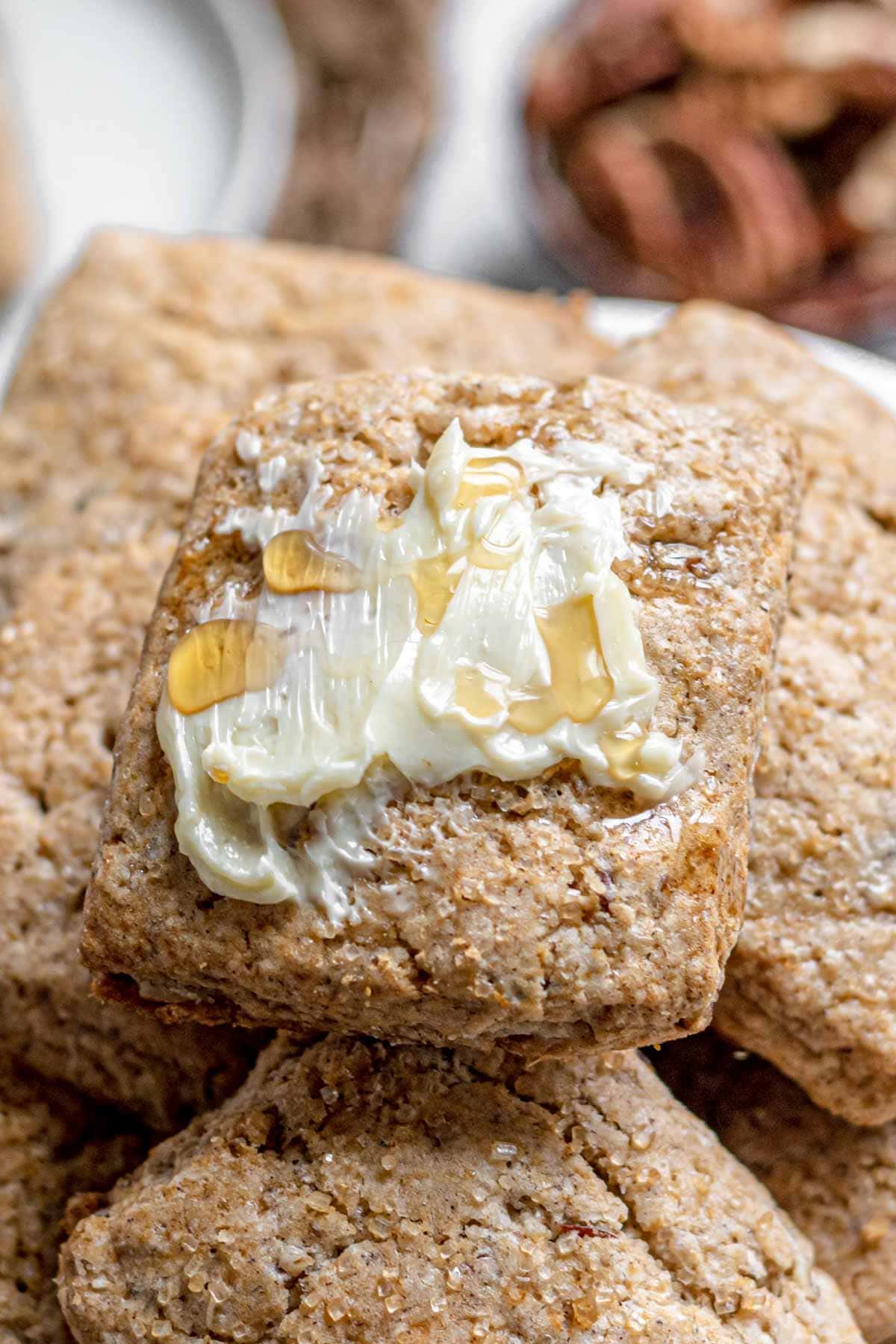 Maple Pecan Biscuits on serving platter with honey and butter