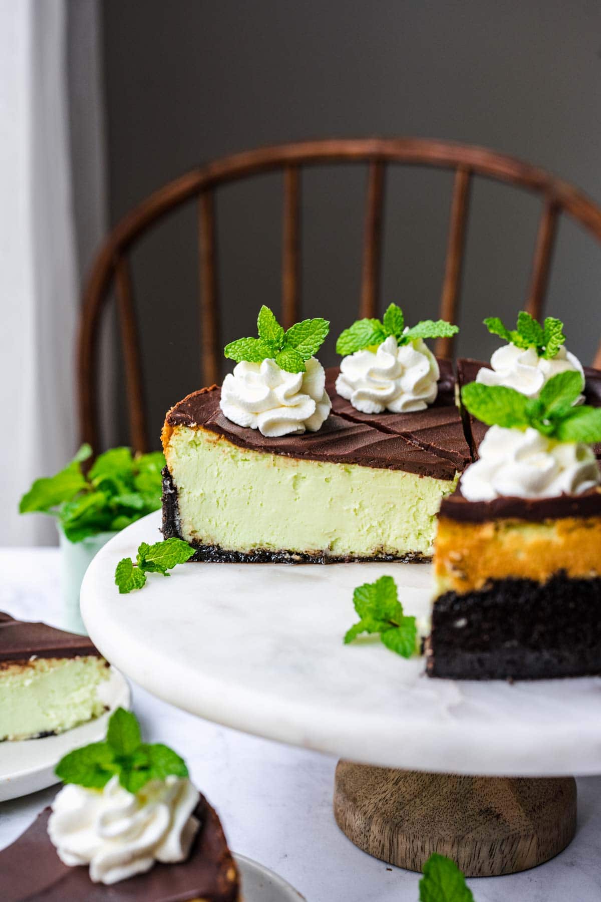 Mint Chocolate Cheesecake sliced on cake stand