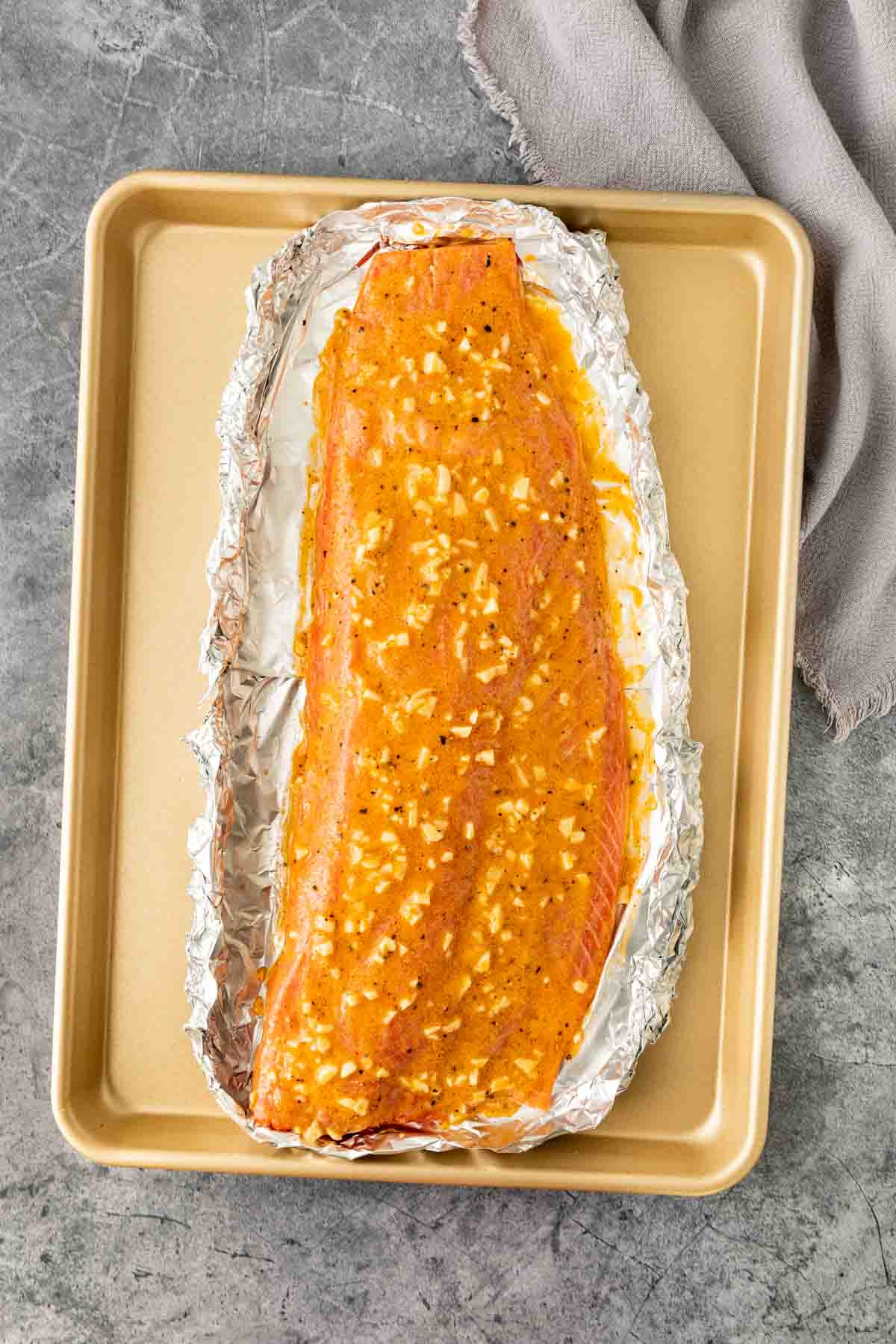 Oven Baked Salmon filet and seasoning mixture on baking sheet before baking