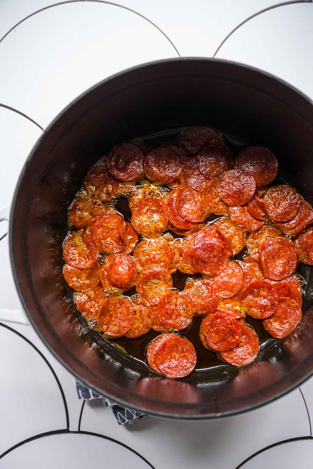 Pepperoni Pizza Soup pepperoni in cooking pot