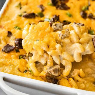 Philly Cheesesteak Mac and Cheese scooping from baking dish 1x1