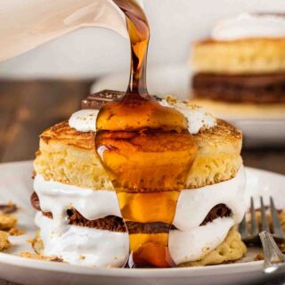 S'mores Pancakes pouring syrup over stack 1x1