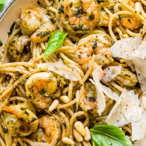 Spaghetti and pine nuts, with pesto sauce and Parmesan.