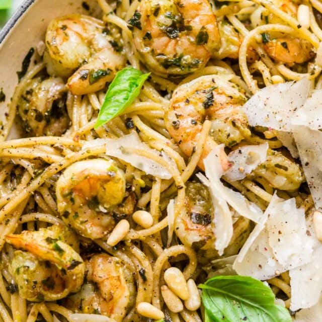 Spaghetti and pine nuts, with pesto sauce and Parmesan.