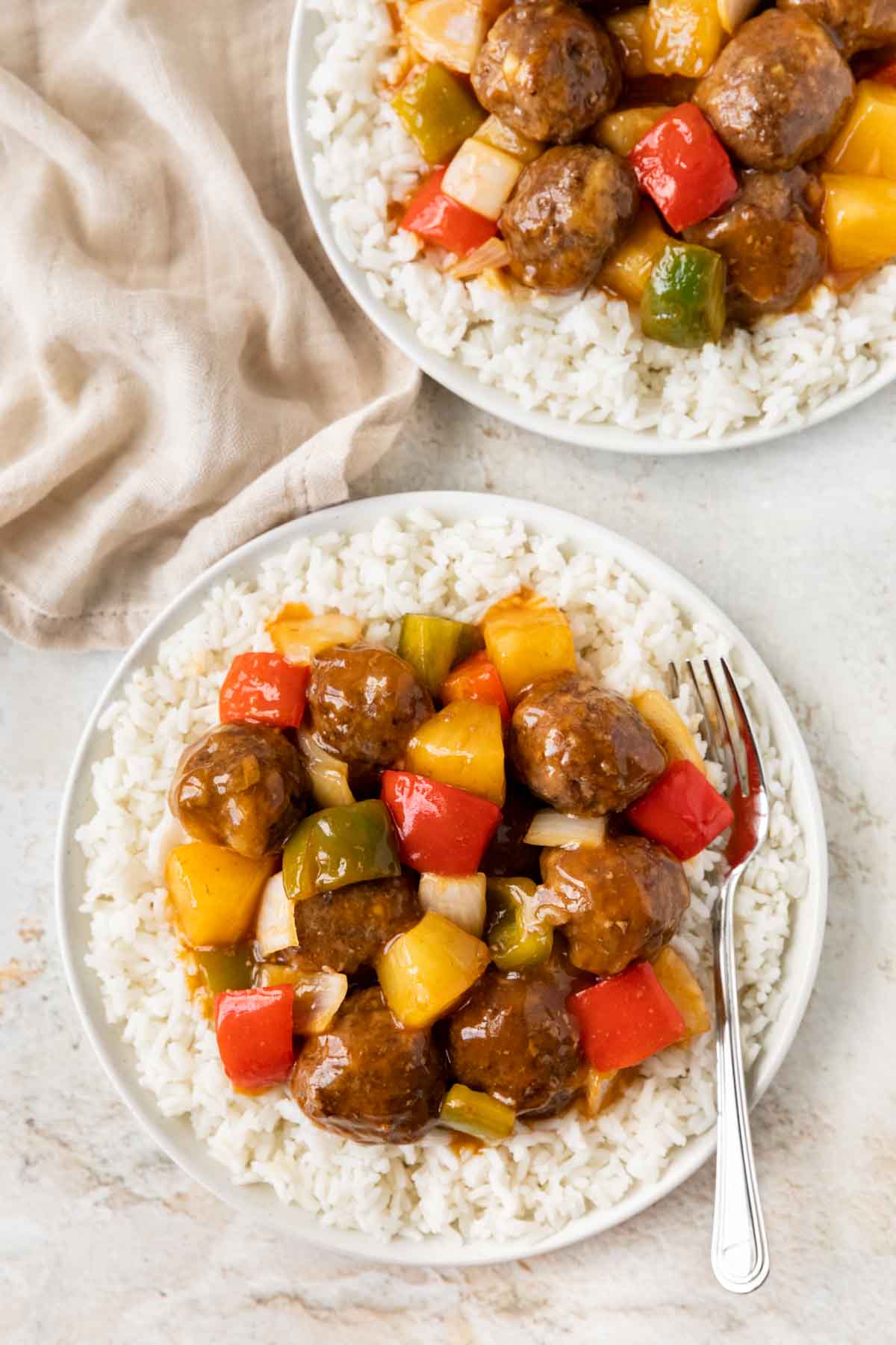 Sweet and Sour Meatballs on serving plate with rice