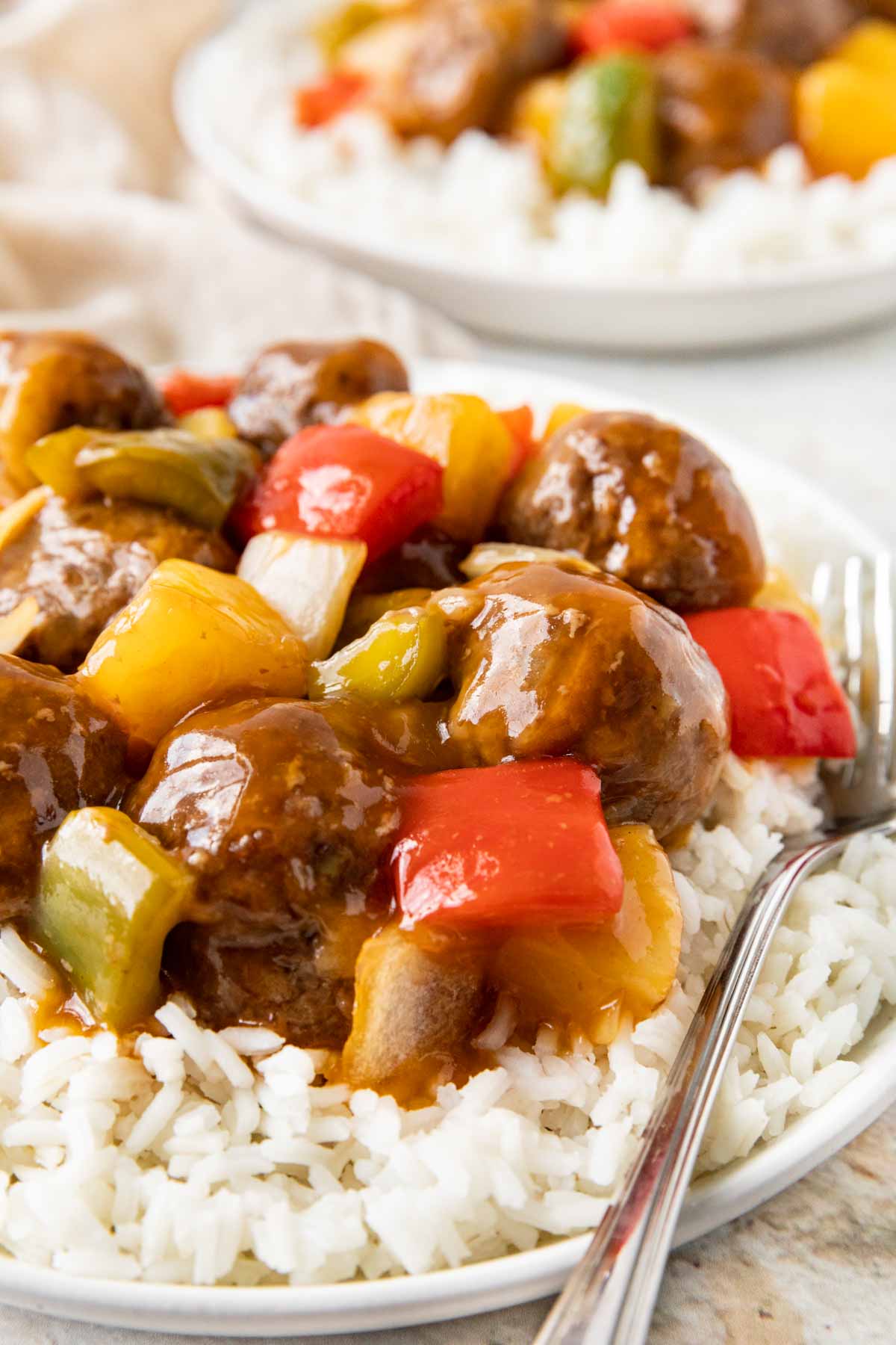 Sweet and Sour Meatballs on serving plate with rice