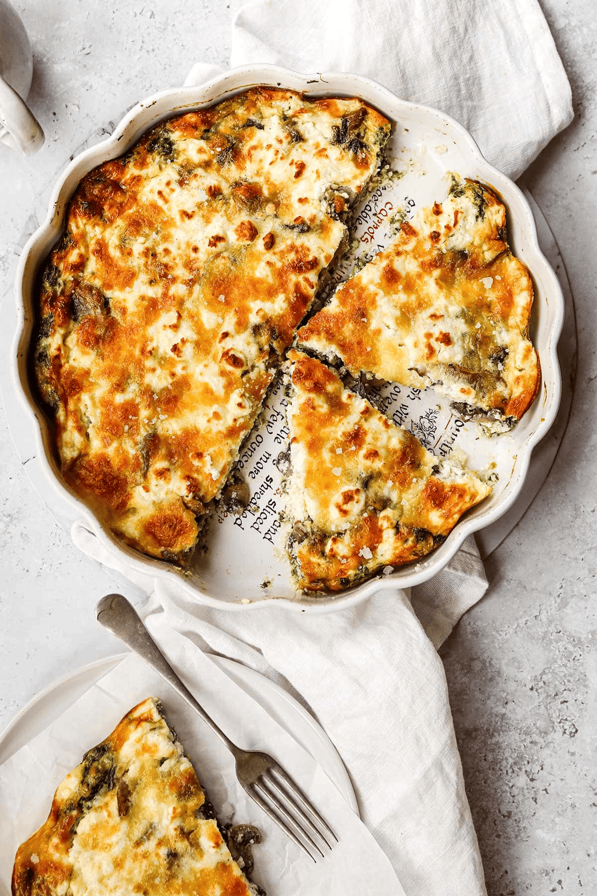Sliced quiche in a pan and one on a serving plate