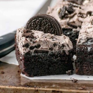 chocolate Oreo cake with one sliced piece