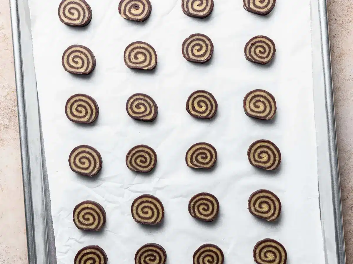 Raw cookies placed on a baking sheet.