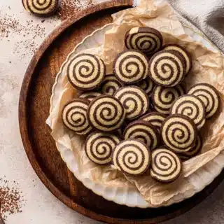 Plate of cookies with chocolate and vanilla swirl.