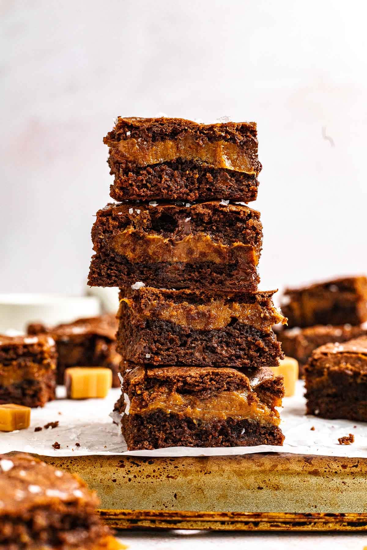 Caramel Stuffed Brownies stacked on counter