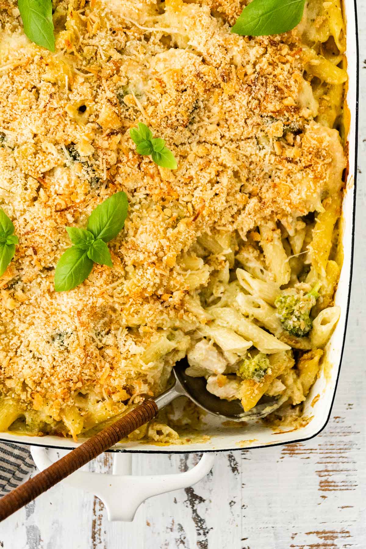 Chicken Broccoli Pasta Bake scooping from baking dish