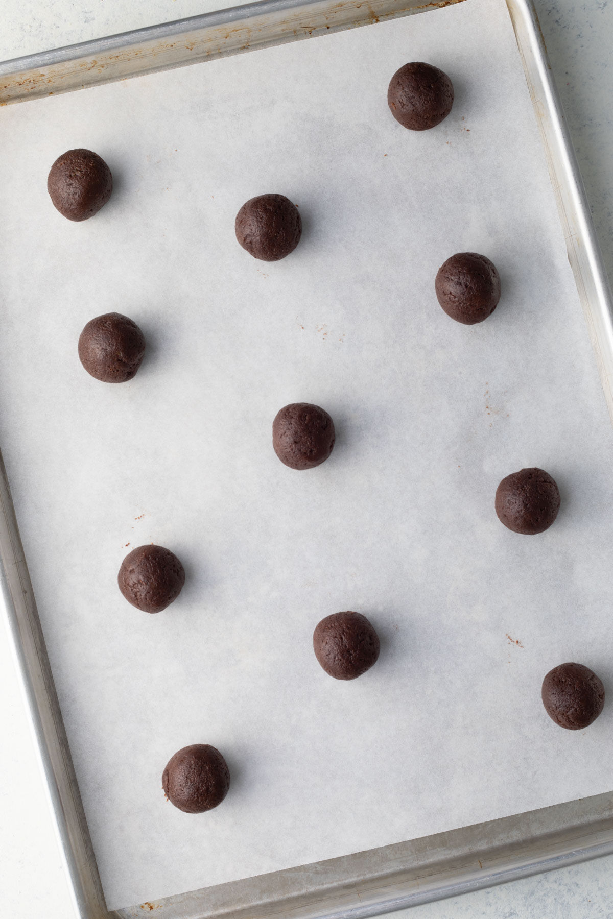 Chocolate Snowball dough on baking sheet