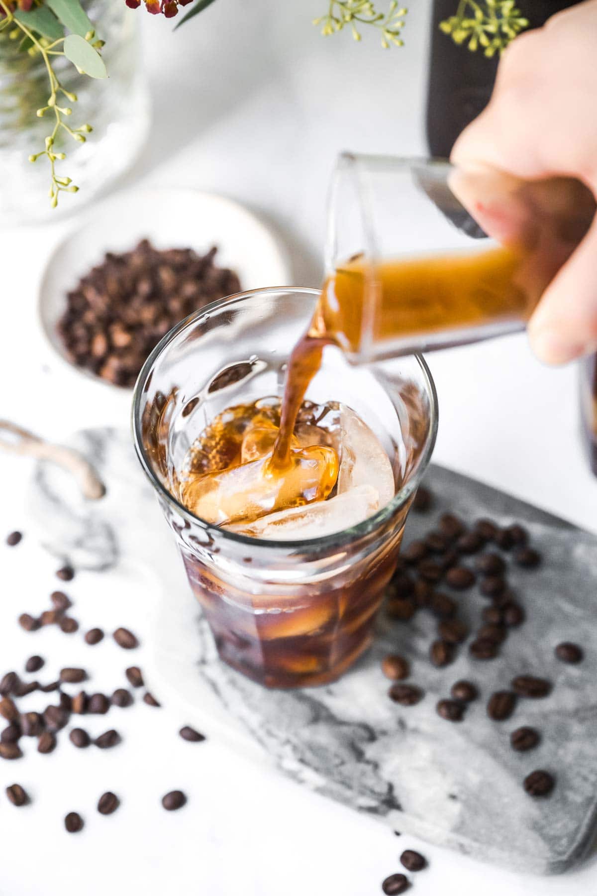 Cold Brew Coffee pouring concentrate into glass
