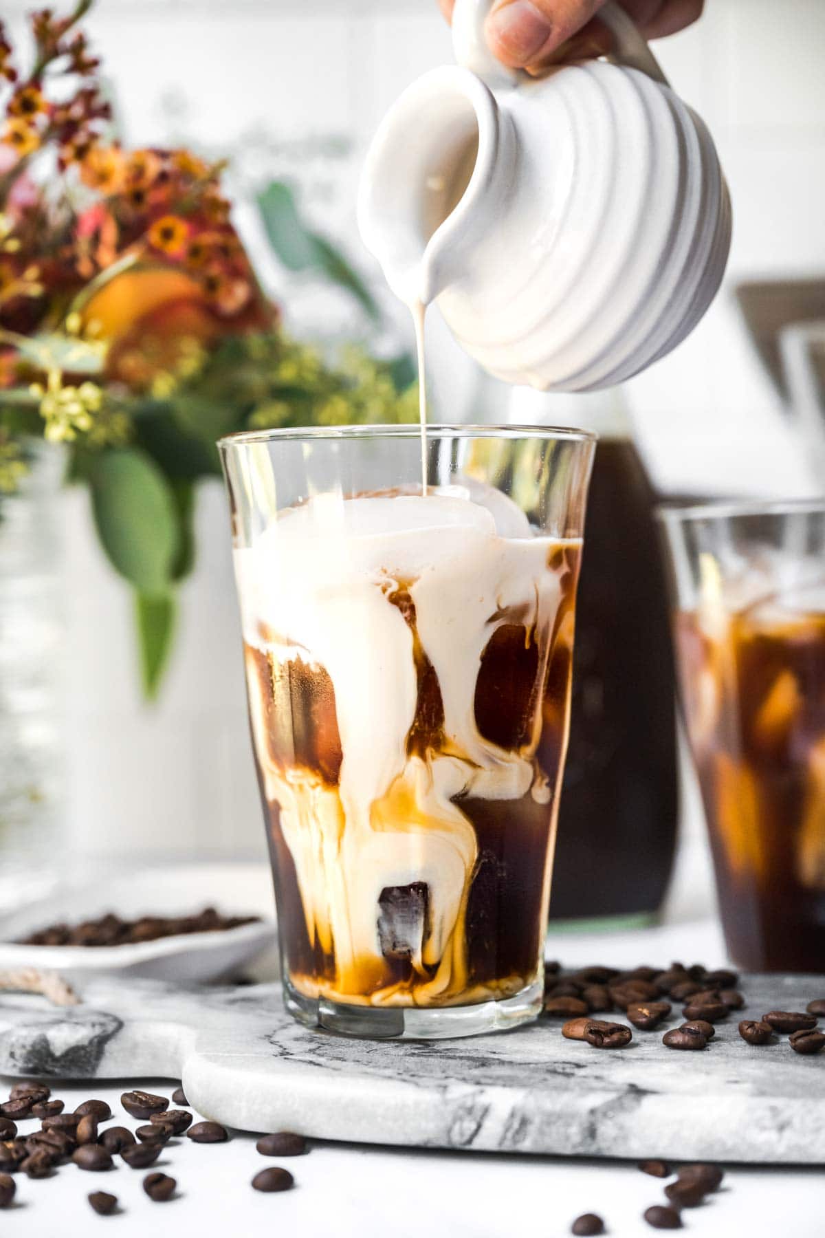 Cold Brew Coffee pouring milk into glass