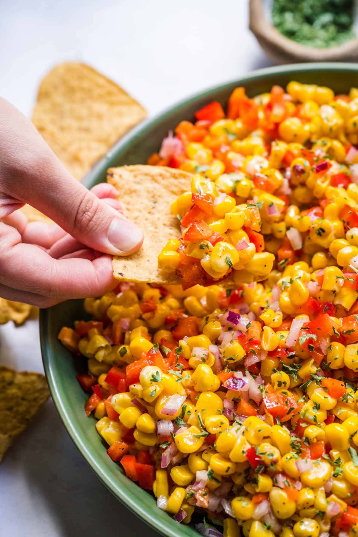 Corn Salad scooping with chip