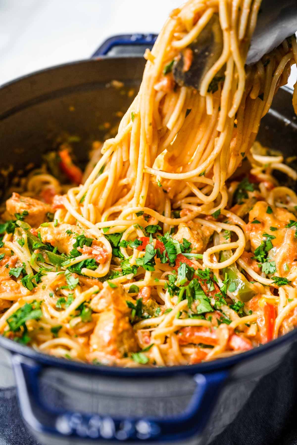 Creamy Chicken Fajita Pasta serving from cooking pot